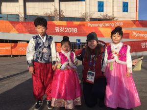 Heather with three korean chlldren dressed in traditional korean outfits